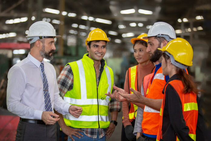 Group of engineers discussing employment rights