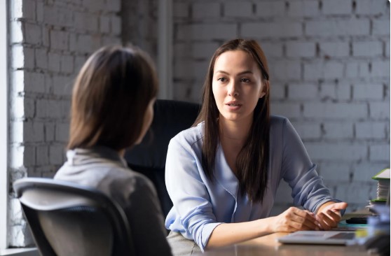 Two people discussing reasonable adjustments in the workplace